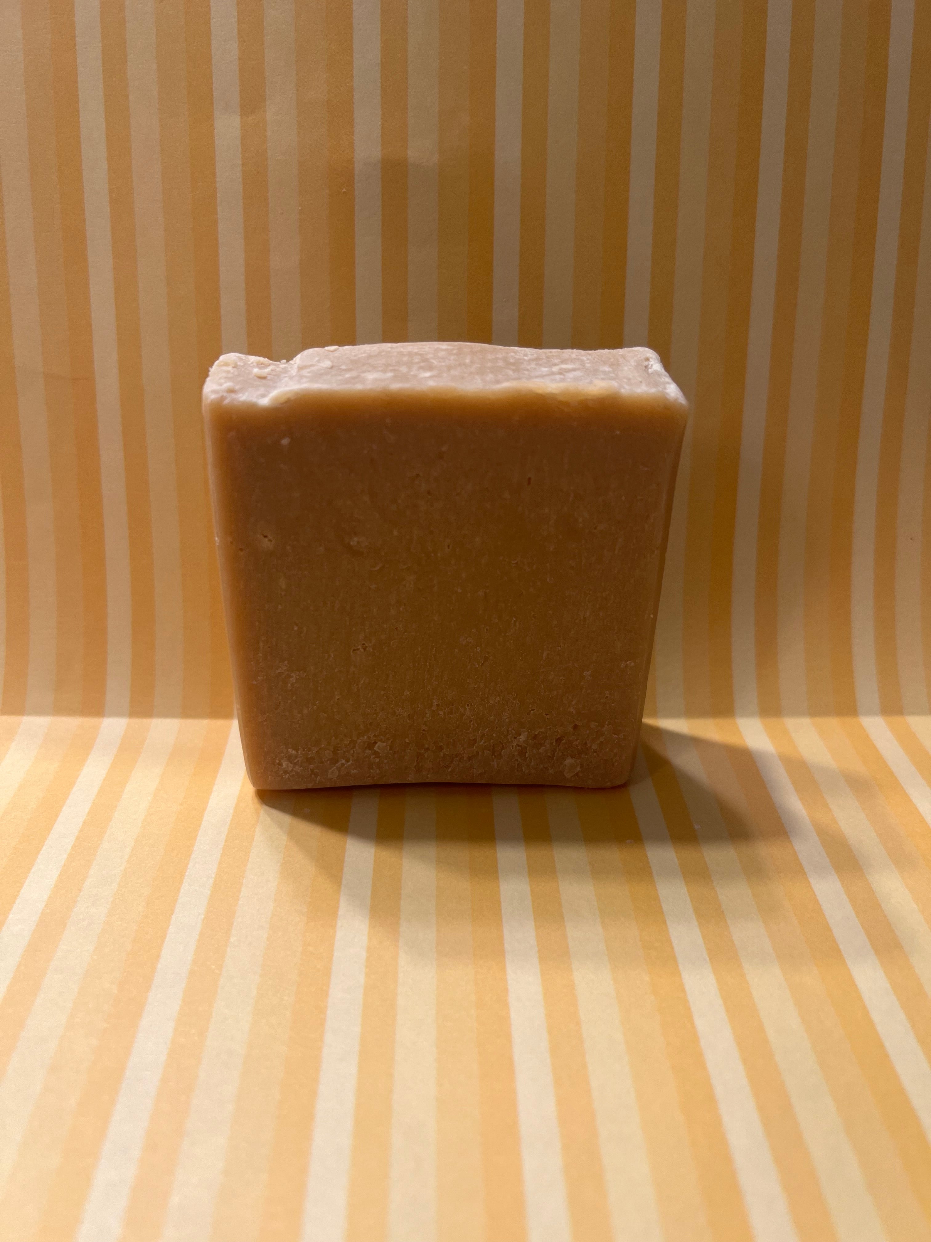 Handcrafted Goat Milk Honey and Oats soap bar wrapped in Indigo Artesian Soap packaging